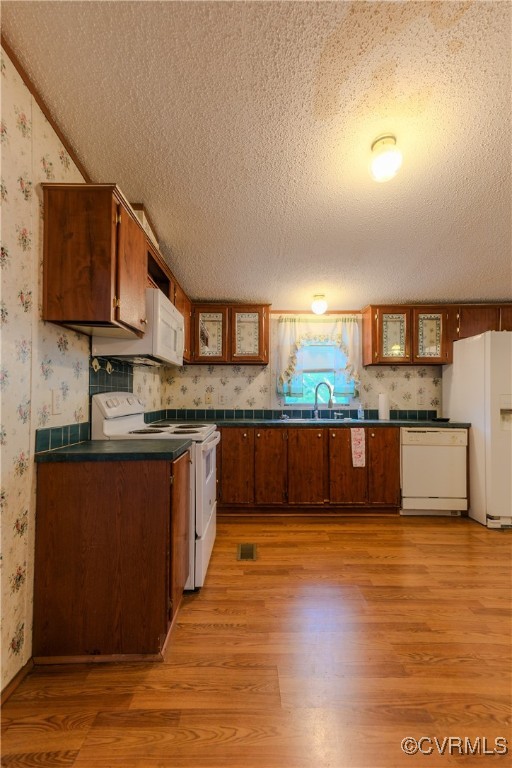 1455 Hendricks Road Pamplin, VA 23958 - Photo 15 of 37 Kitchen with white appliances, wallpapered walls,