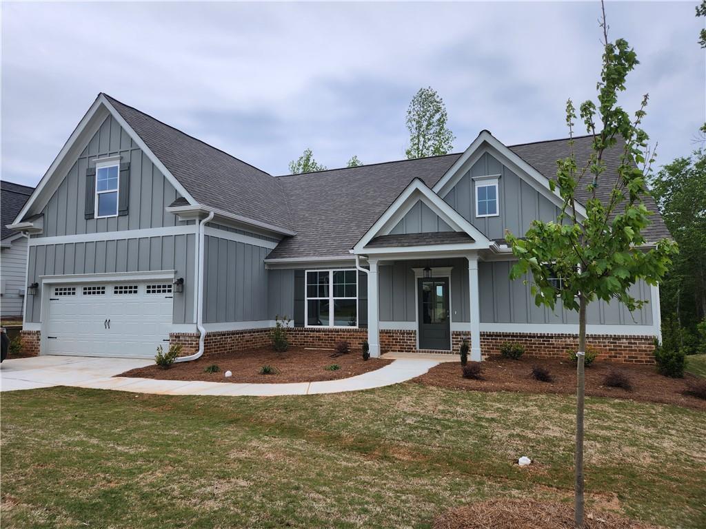 a front view of a house with garage