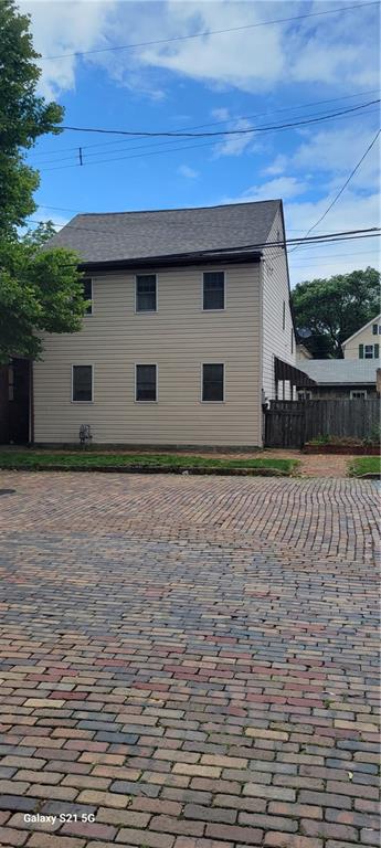 199 12th Street Ambridge, PA 15003 - Photo 1 of 1 a house with trees in the background