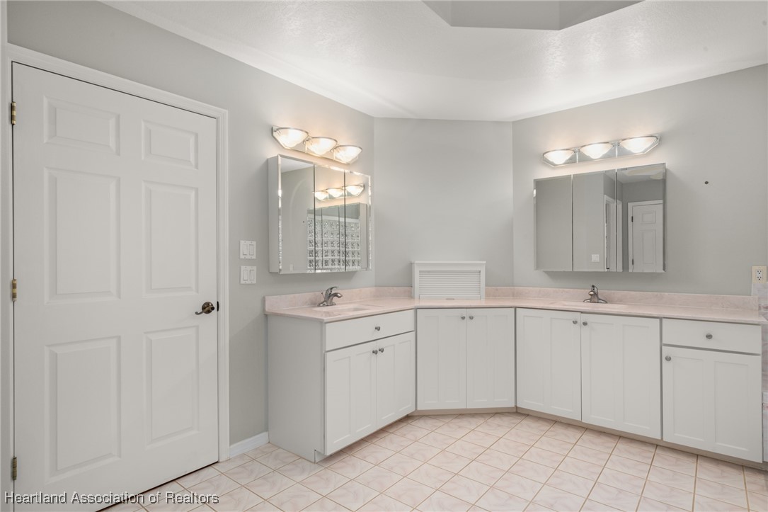 1630 Sentinel Road Sebring, FL 33875 - Photo 14 of 48 Stately master ensuite with cultured marble double sink vanity