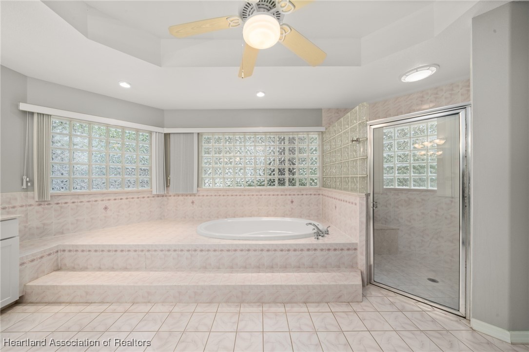 1630 Sentinel Road Sebring, FL 33875 - Photo 15 of 48 Master ensuite also has tub and walk-in tile shower