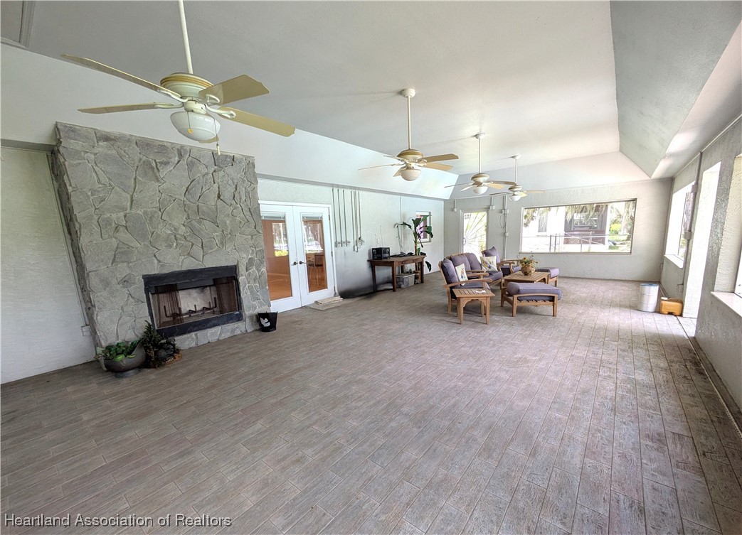 1630 Sentinel Road Sebring, FL 33875 - Photo 28 of 48 Expansive porch features fireplace