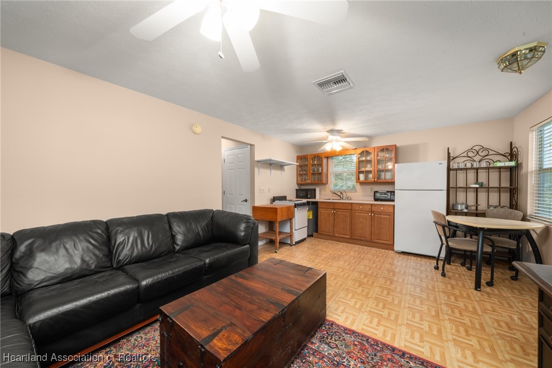 1630 Sentinel Road Sebring, FL 33875 - Photo 30 of 48 View from living room into kitchen of apt