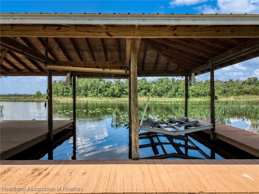 1630 Sentinel Road Sebring, FL 33875 - Photo 41 of 48 Boathouse has two boatlifts, for a pontoon boat and bass boat