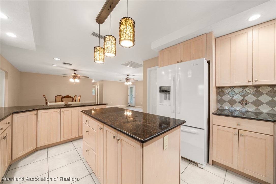 1630 Sentinel Road Sebring, FL 33875 - Photo 7 of 48 Kitchen has slide-outs, lazy Susan cabinet and spice cabinet