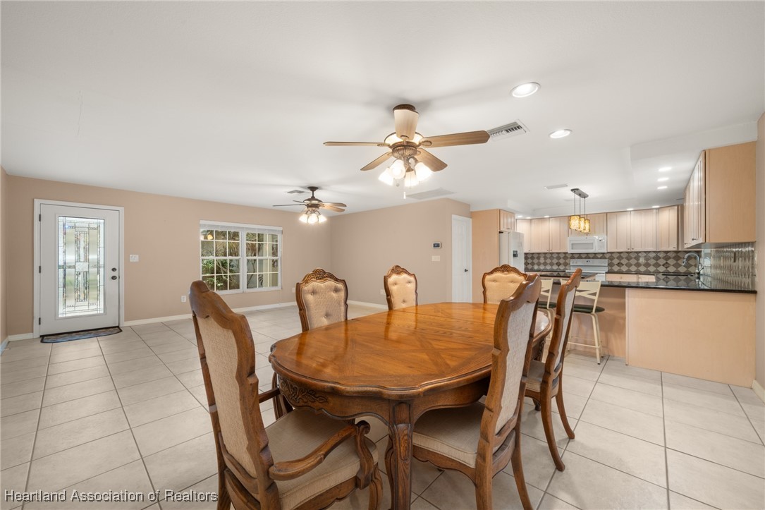 1630 Sentinel Road Sebring, FL 33875 - Photo 8 of 48 Dining room overlooking living room and kitchen