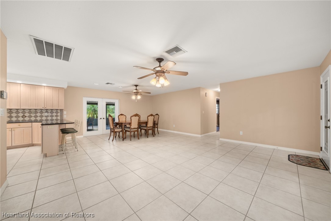 1630 Sentinel Road Sebring, FL 33875 - Photo 9 of 48 Great room consists of spacious living room, dining room and large kitchen