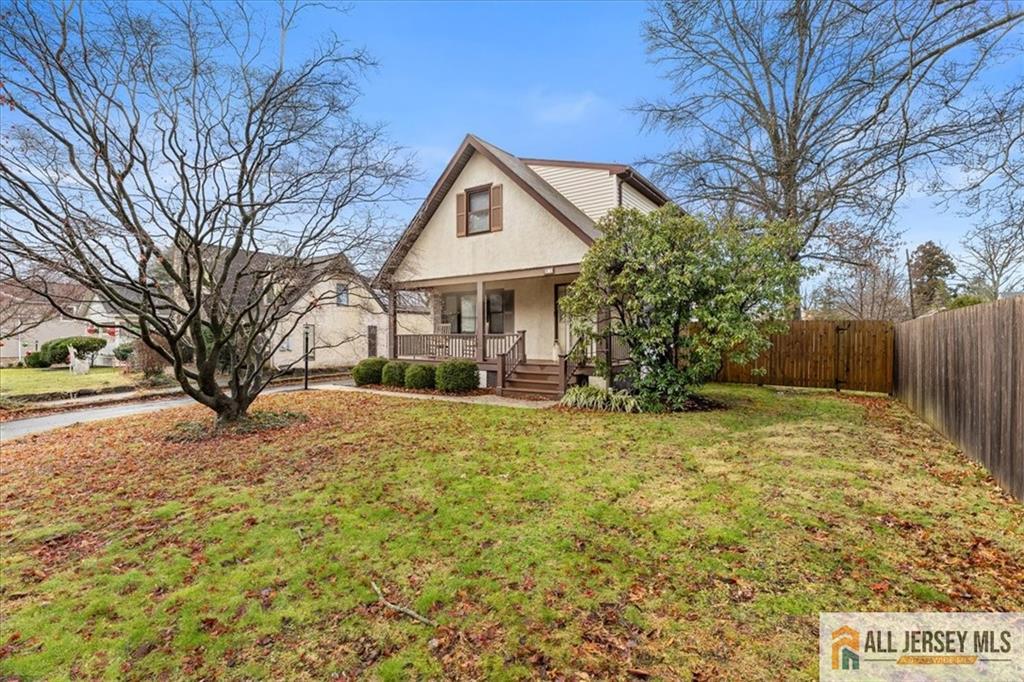 a view of a house with a yard covered in snow