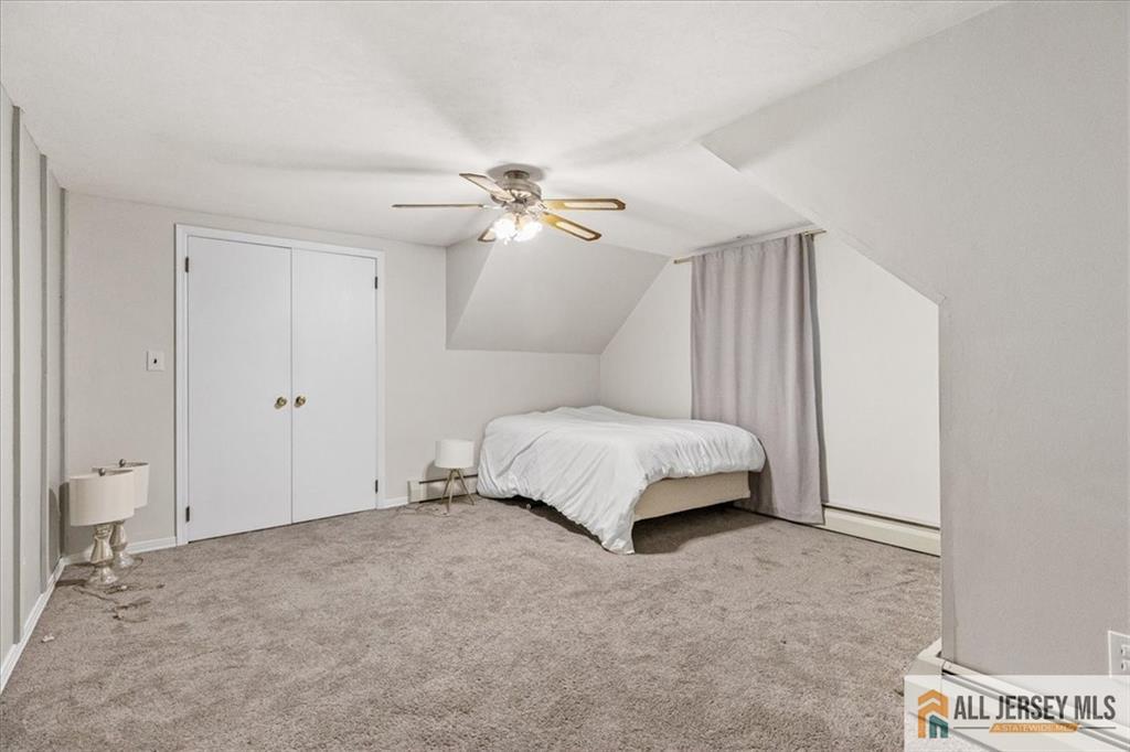 21 Heathcote Brook Road Kingston, NJ 08528 - Photo 15 of 24 a spacious bedroom with a bed and a ceiling fan
