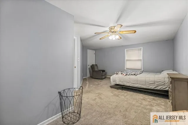 a bedroom with bed and window