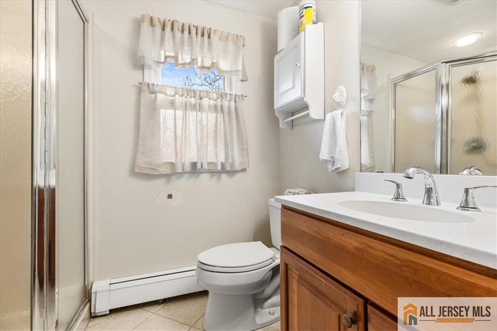 21 Heathcote Brook Road Kingston, NJ 08528 - Photo 20 of 24 a bathroom with a granite countertop sink mirror vanity and toilet