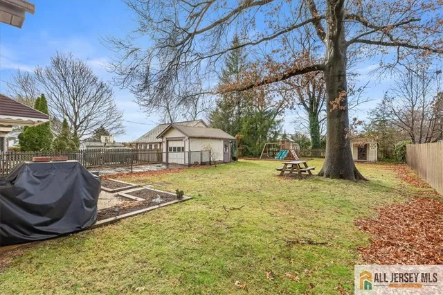 a view of a house with pool and sitting area