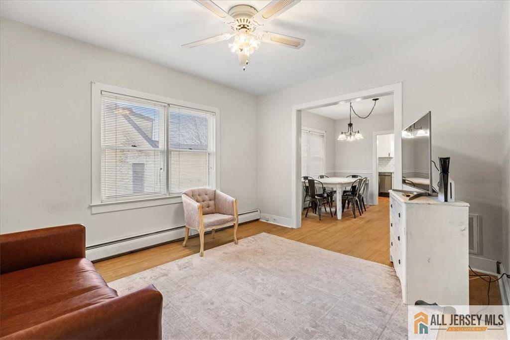 21 Heathcote Brook Road Kingston, NJ 08528 - Photo 6 of 24 a living room with furniture and a chandelier