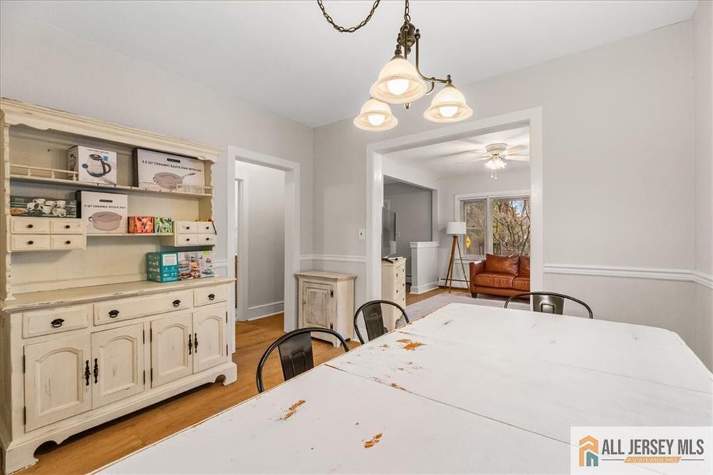 21 Heathcote Brook Road Kingston, NJ 08528 - Photo 9 of 24 a view of a center kitchen island with furniture and wooden floor