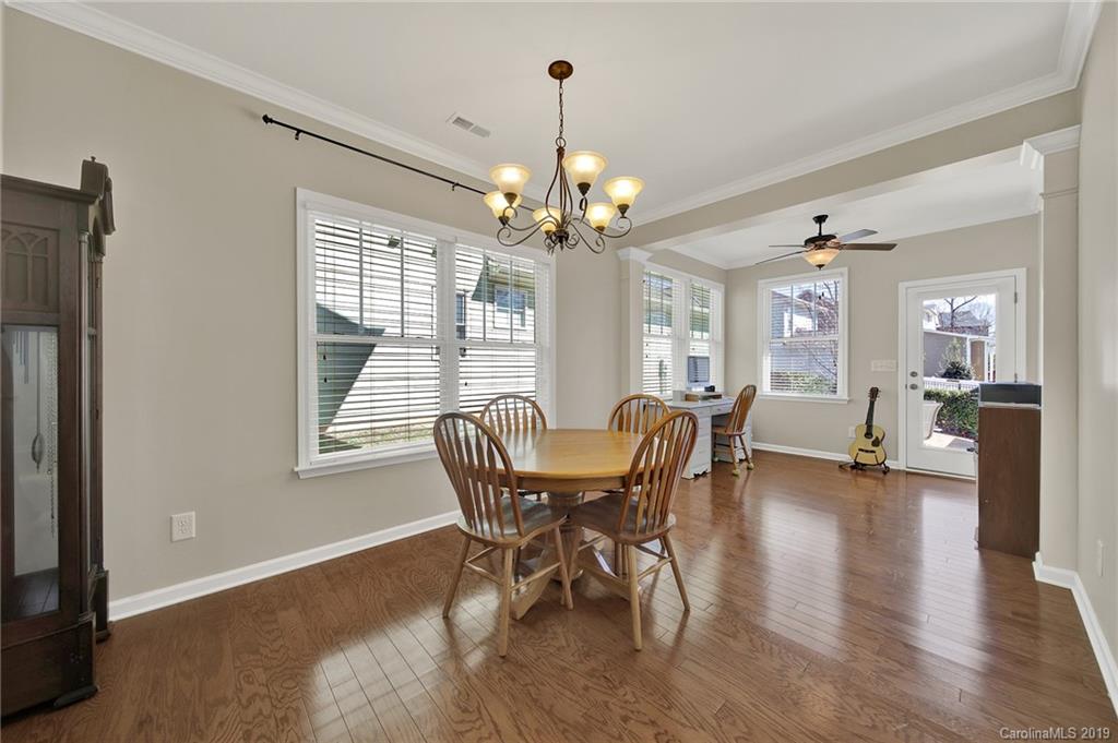 3550 Richard's Crossing Fort Mill, SC 29708 - Photo 12 of 33 a dining room with furniture a chandelier and wooden floor