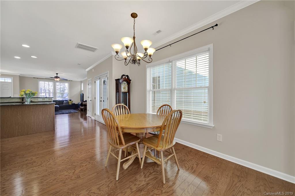 3550 Richard's Crossing Fort Mill, SC 29708 - Photo 13 of 33 a view of a dining room with furniture wooden floor and chandelier