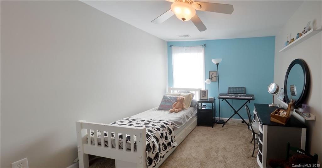 3550 Richard's Crossing Fort Mill, SC 29708 - Photo 27 of 33 a bedroom with a bed a desk and chair