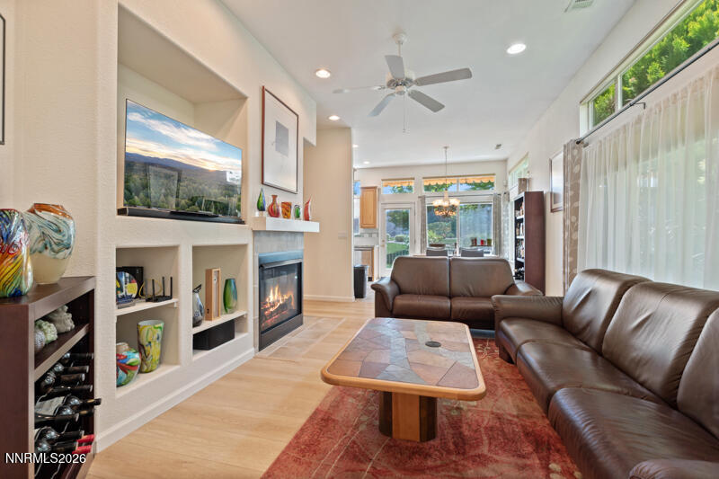 403 Sierra Leaf Circle Reno, NV 89511 - Photo 7 of 25 a living room with fireplace furniture and a flat screen tv