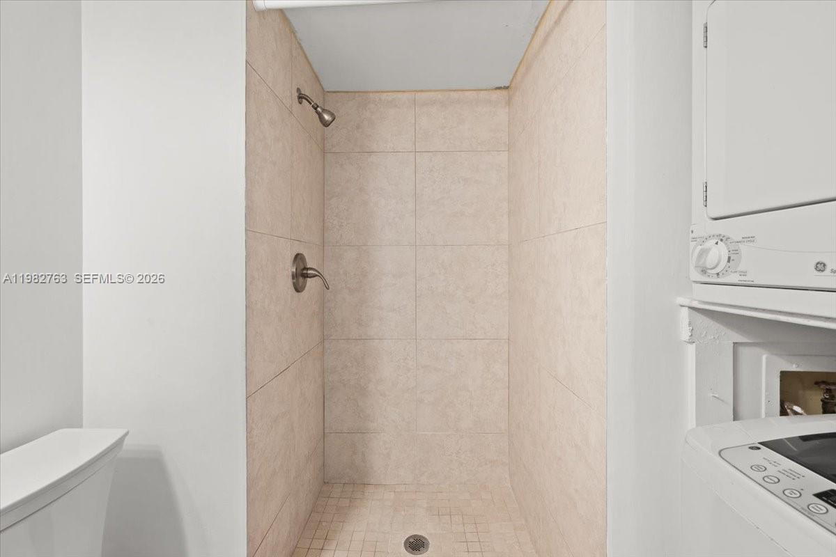 7944 Eastlake Drive, Unit D Boca Raton, FL 33433 - Photo 23 of 29 a bathroom with a shower a toilet and a sink