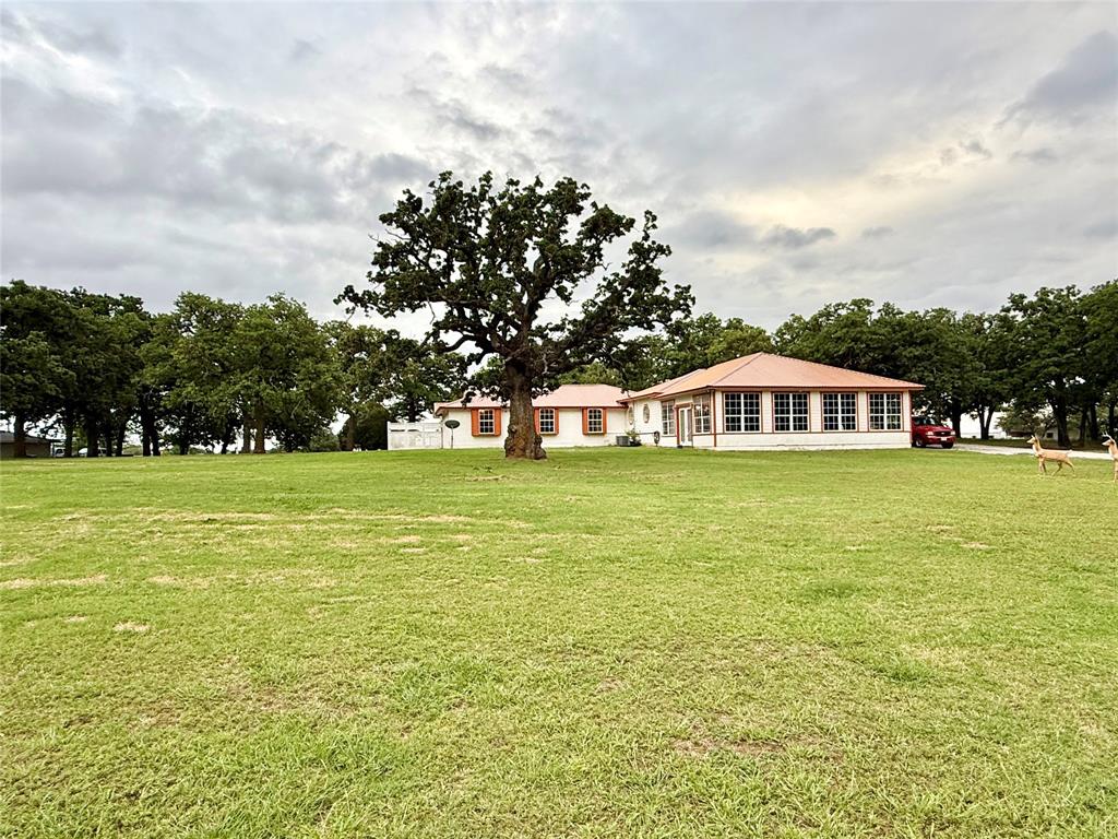 4216 Greenwood Road Weatherford, TX 76088 - Photo 22 of 26 Back of house & yard viewed from the shop
