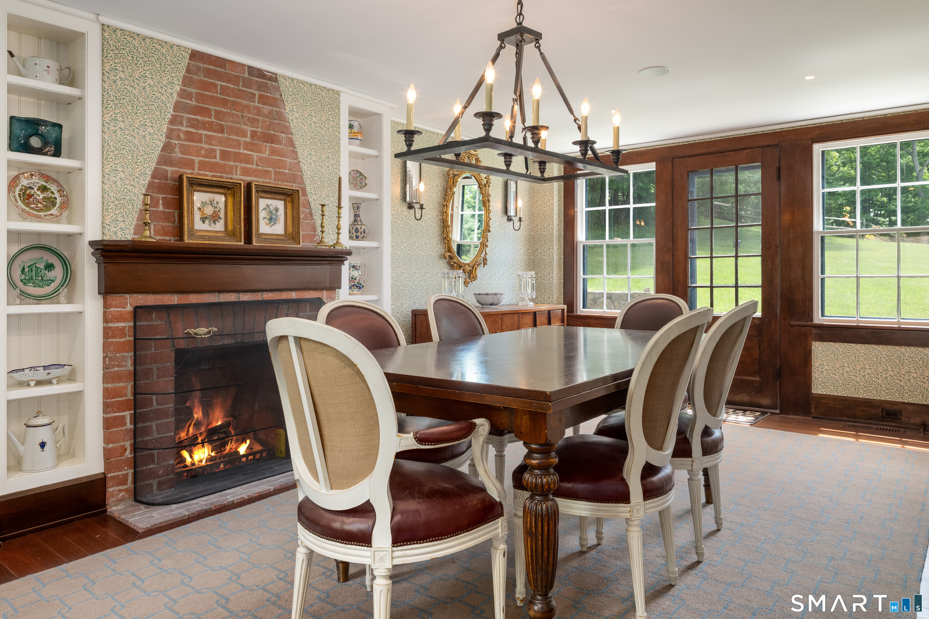 240 Umpawaug Road Redding, CT 06896 - Photo 14 of 40 Formal Dining Room. Wood-burning fireplace, built-in shelving, conveniently located off the kitchen and with access to/from the Great Room.
