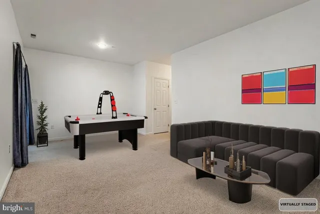 a living room with furniture and a rug