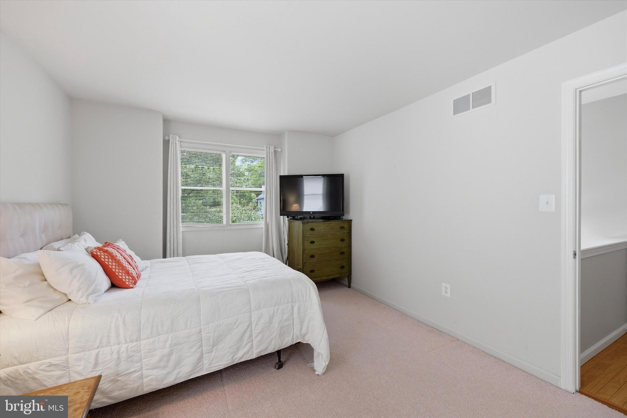 320 Maple Avenue Wyncote, PA 19095 - Photo 19 of 28 a bedroom with a bed and a window