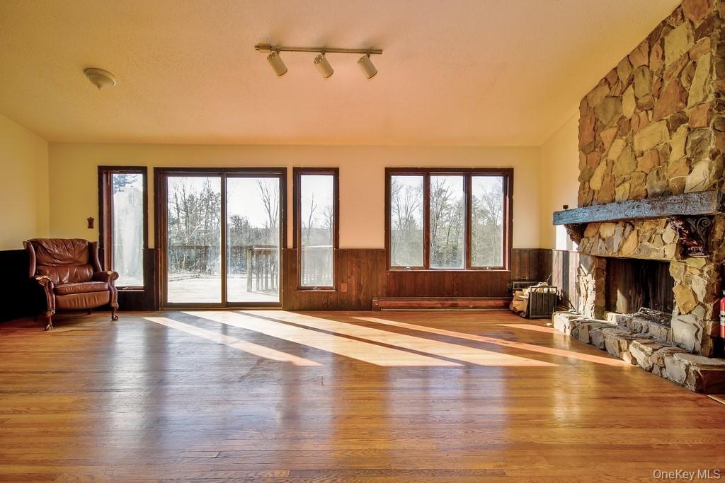 51 Forestburgh Road Forestburgh, NY 12777 - Photo 11 of 35 a living room with furniture and a fireplace