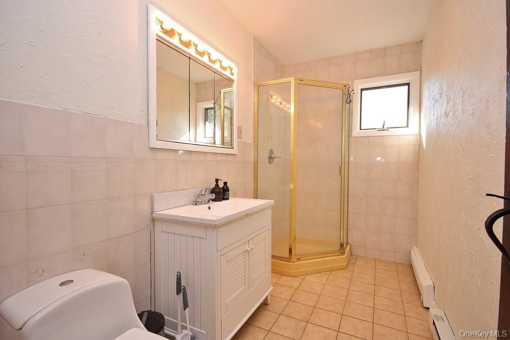 51 Forestburgh Road Forestburgh, NY 12777 - Photo 15 of 35 a bathroom with a sink a toilet and shower