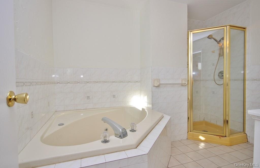 51 Forestburgh Road Forestburgh, NY 12777 - Photo 19 of 35 a bathroom with a tub and shower