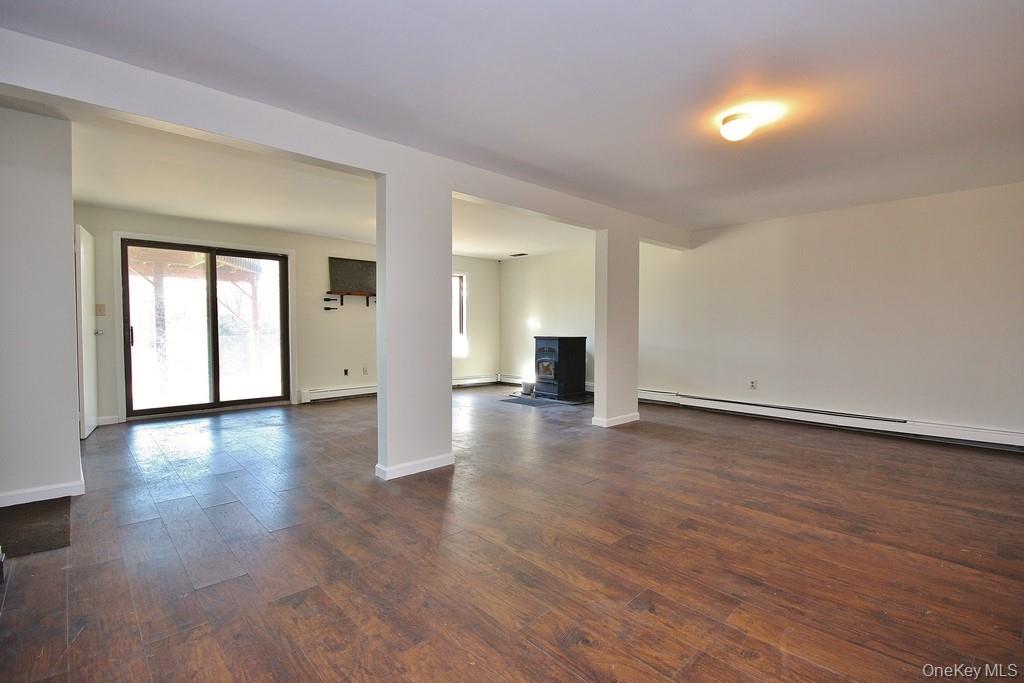 51 Forestburgh Road Forestburgh, NY 12777 - Photo 23 of 35 a view of an empty room with wooden floor and a window