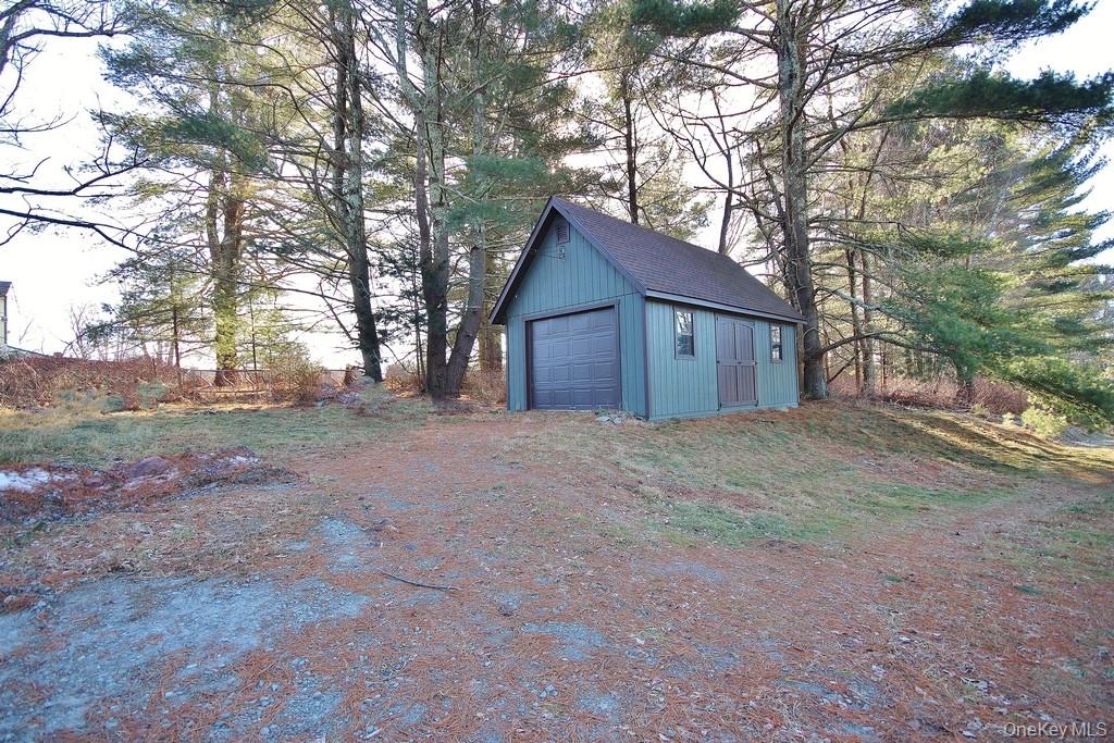 51 Forestburgh Road Forestburgh, NY 12777 - Photo 5 of 35 a view of a house with a large tree and wooden fence
