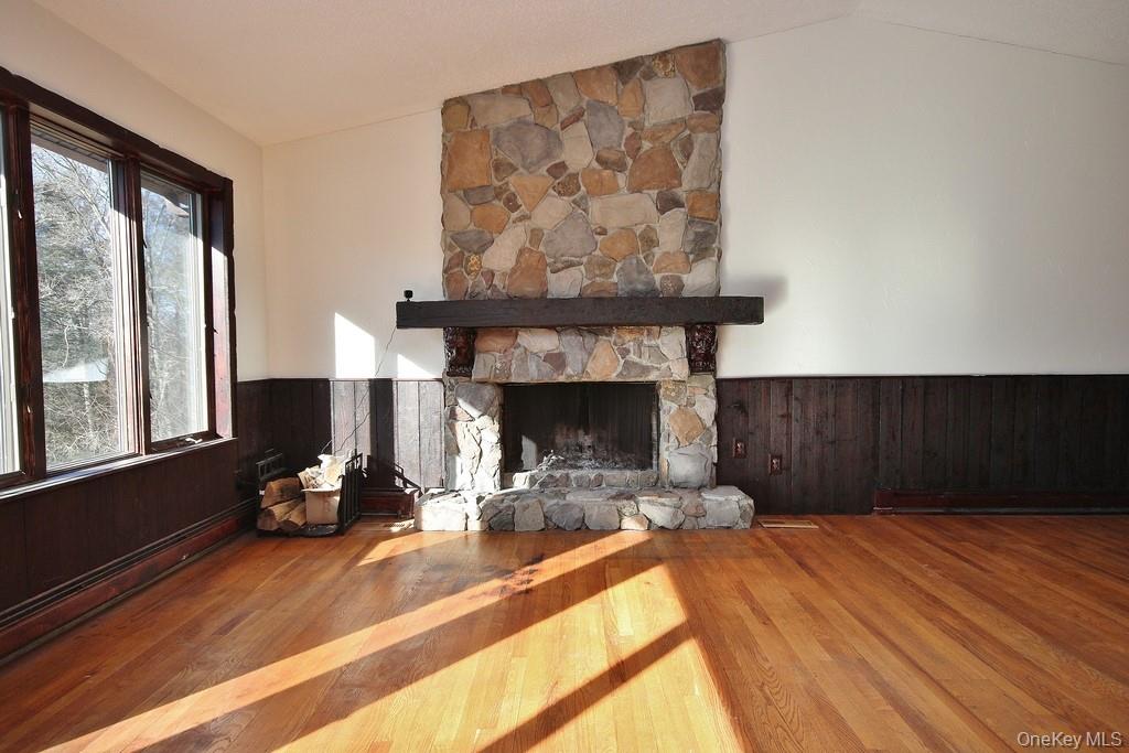 51 Forestburgh Road Forestburgh, NY 12777 - Photo 9 of 35 a living room with furniture and a fireplace