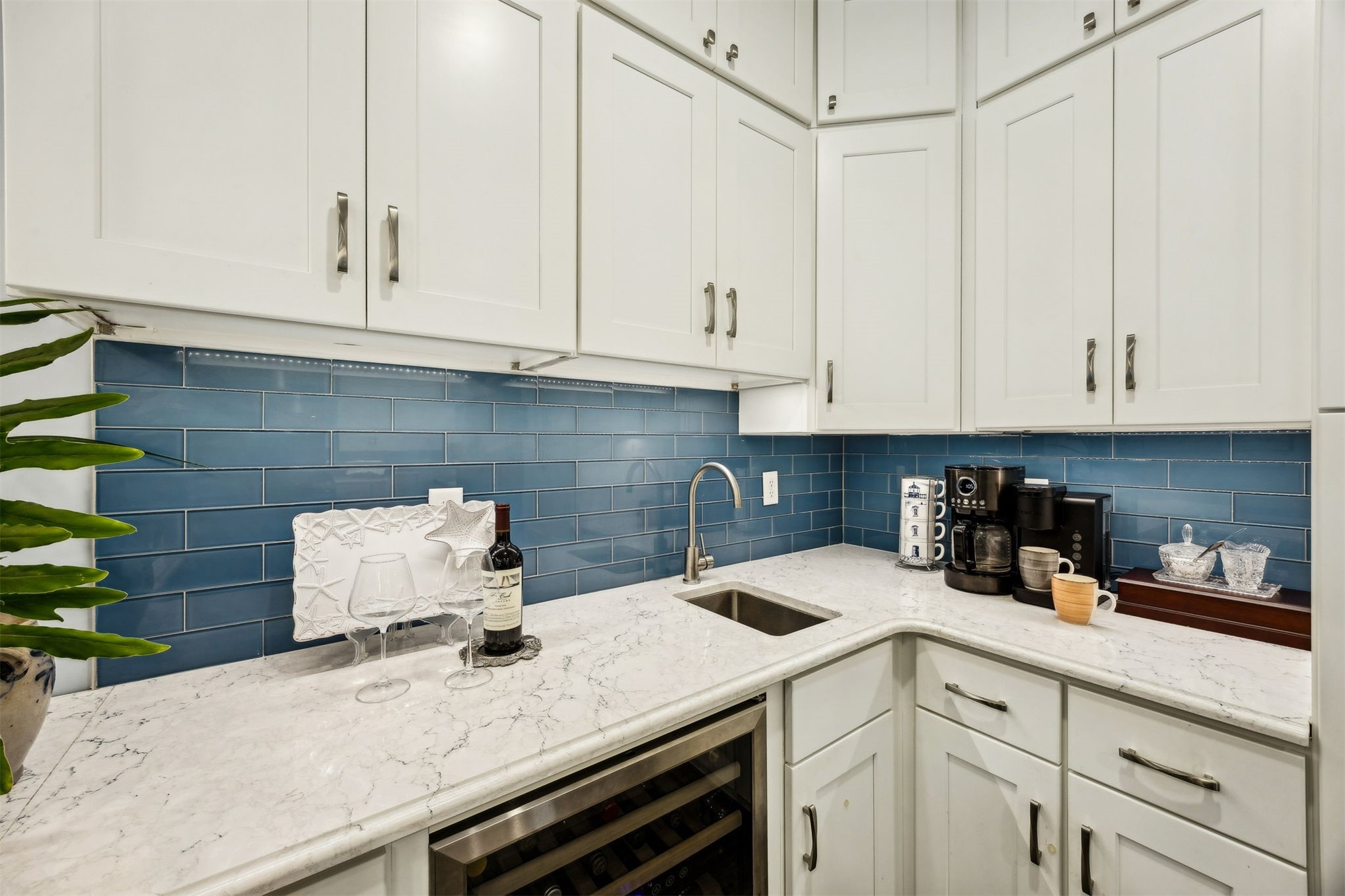 307 Elm Street Fernandina Beach, FL 32034 - Photo 9 of 35 a kitchen with a white cabinets and sink