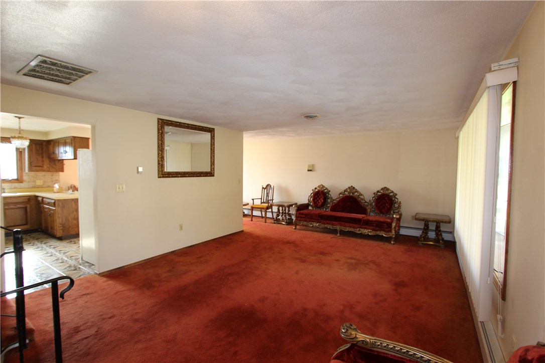 68 Rabbitt Hill Road Cumberland, RI 02864 - Photo 17 of 24 Main level living room to kitchen and dining area