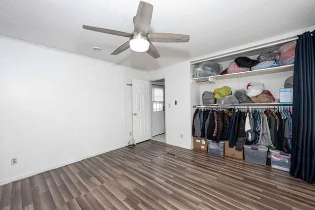 a view of a livingroom with wooden floor