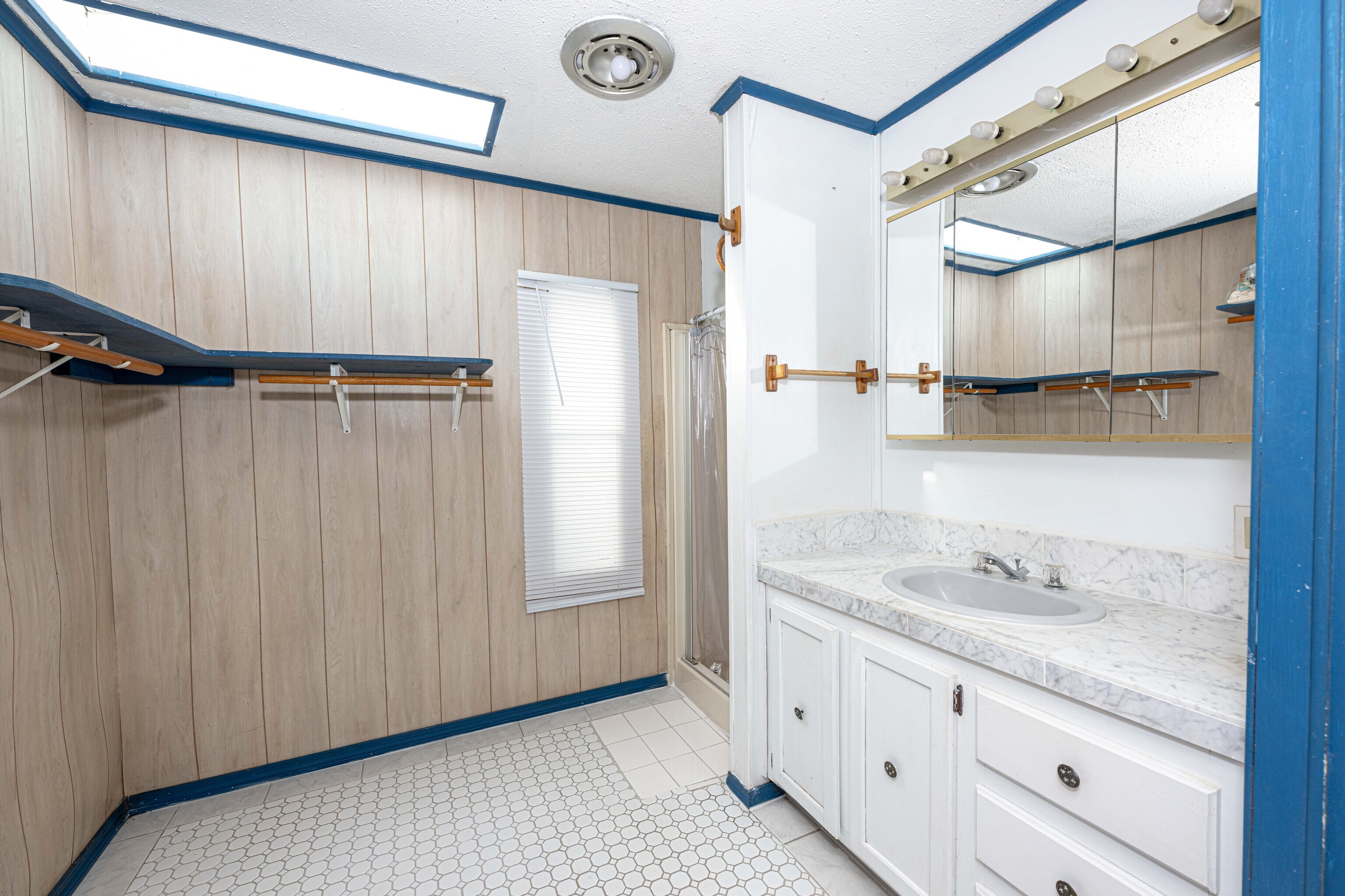 525 East Main Street Branford, CT 06405 - Photo 12 of 20 a bathroom with a granite countertop sink and mirror