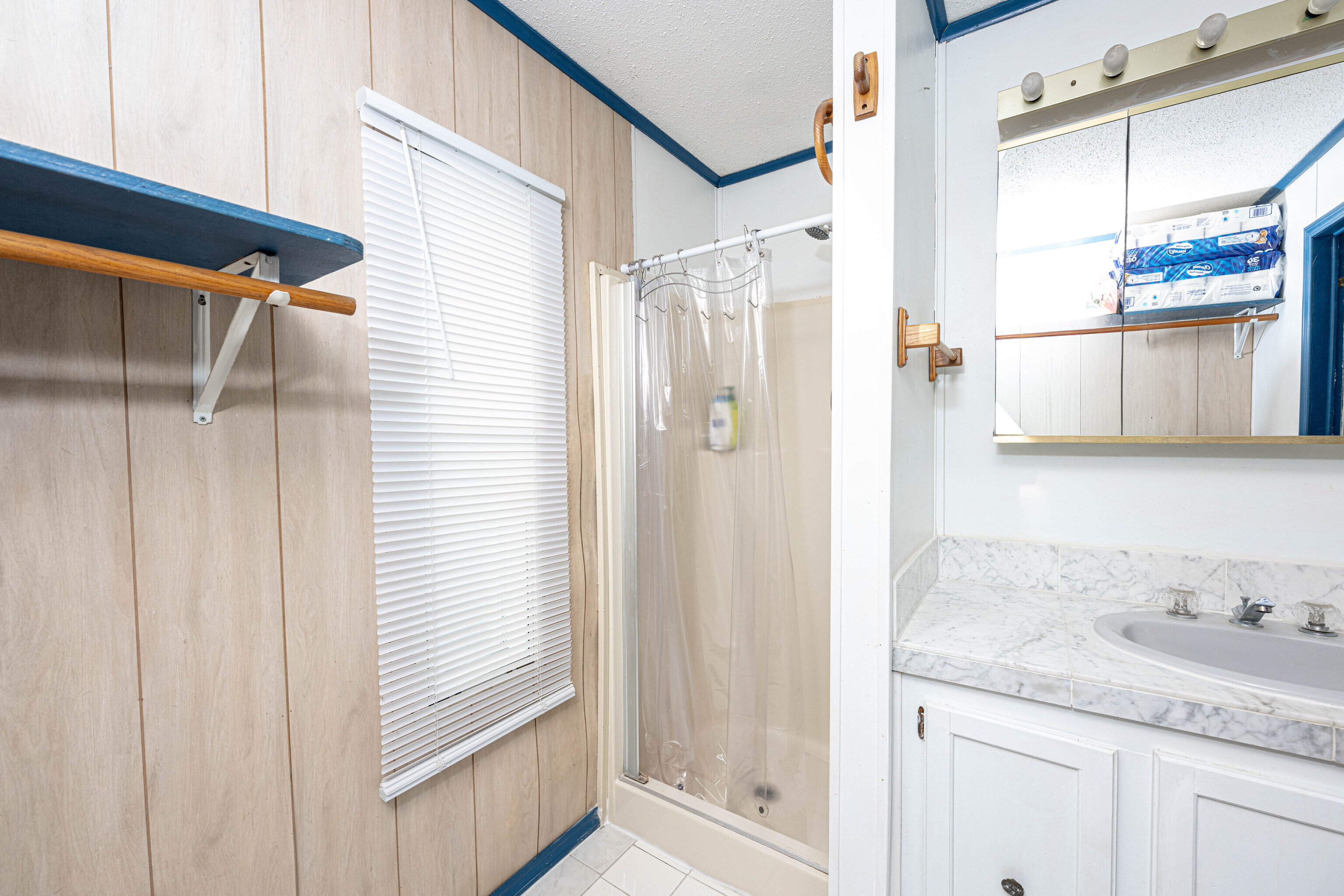 525 East Main Street Branford, CT 06405 - Photo 13 of 20 a bathroom with a granite countertop sink a mirror and shower