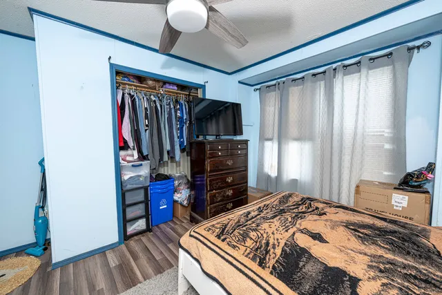 a bedroom with a bed and a closet