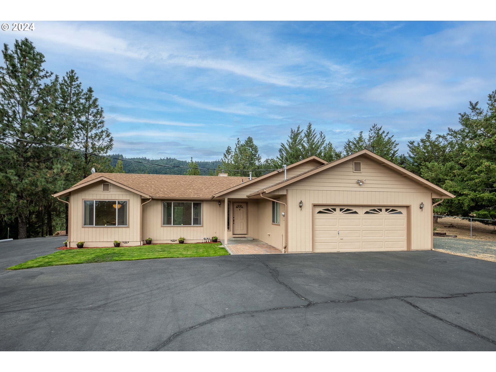 6600 Tunnel Loop Road Grants Pass, OR 97526 - Photo 1 of 43 a view of house and outdoor space
