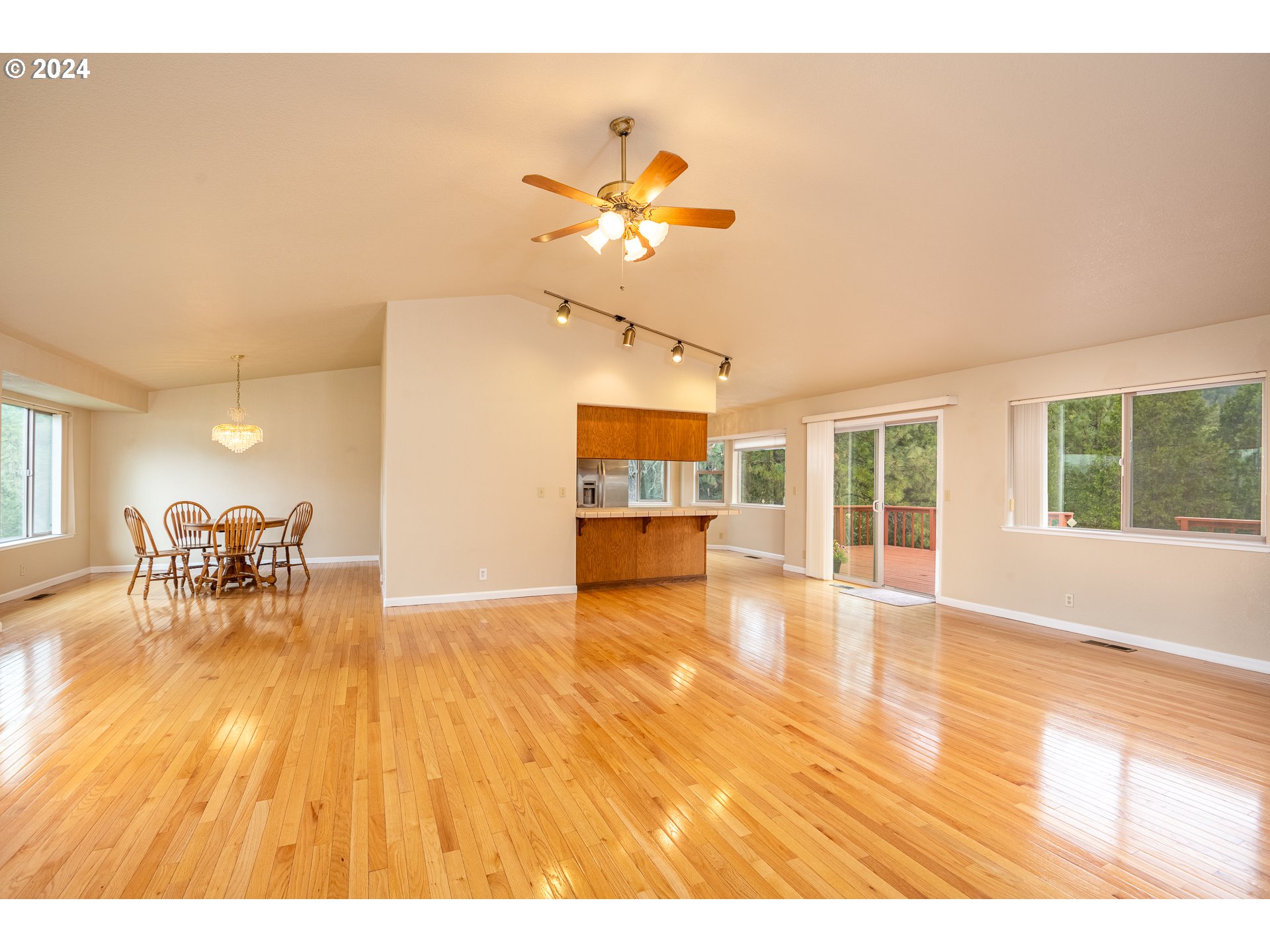 6600 Tunnel Loop Road Grants Pass, OR 97526 - Photo 12 of 43 a view of a livingroom with wooden floor and a ceiling fan