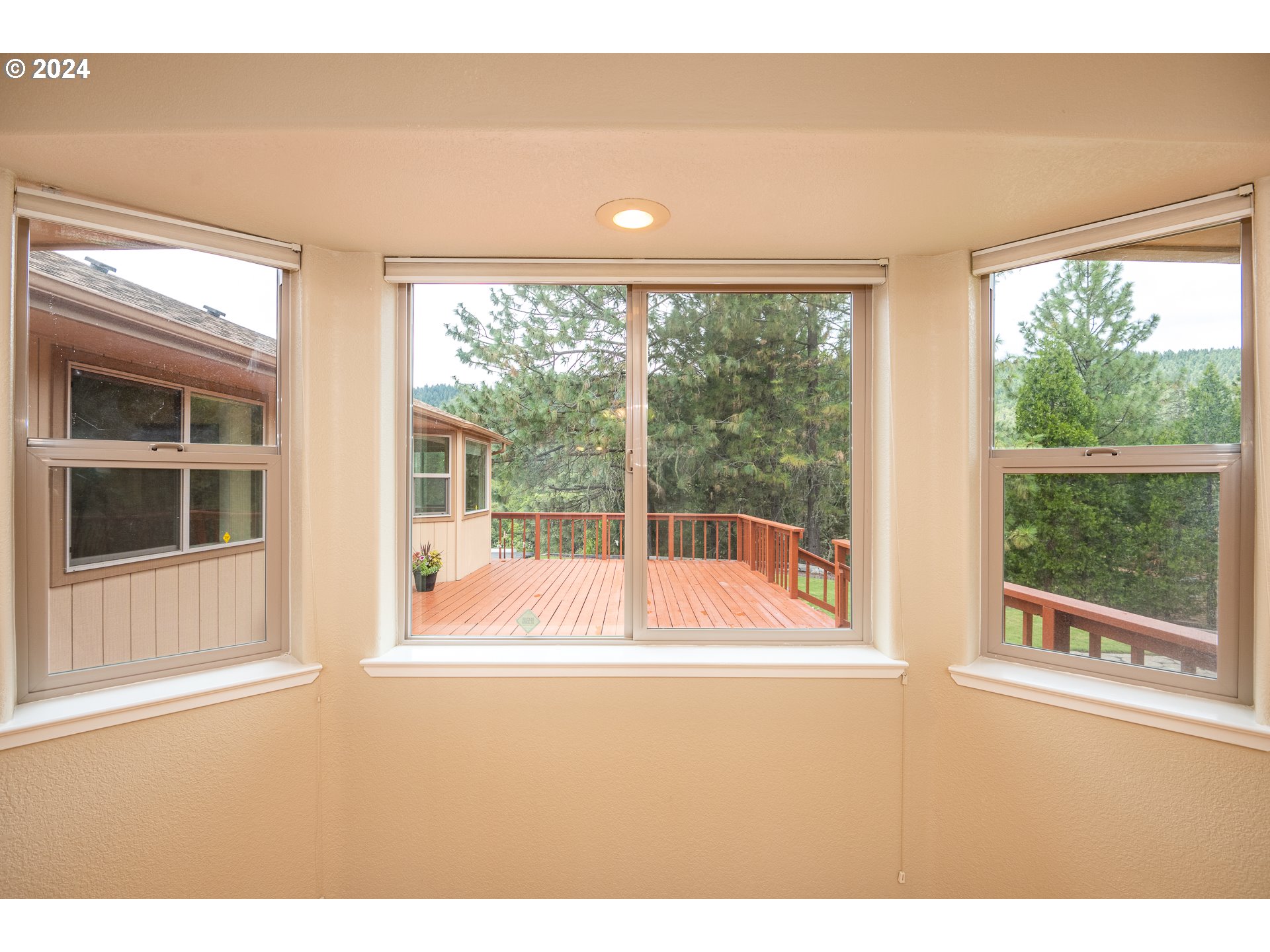 6600 Tunnel Loop Road Grants Pass, OR 97526 - Photo 17 of 43 a bathroom with a large window and a swimming pool