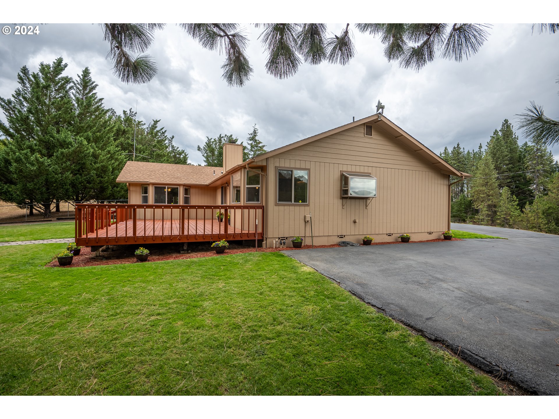 6600 Tunnel Loop Road Grants Pass, OR 97526 - Photo 7 of 43 a view of backyard with deck and garden