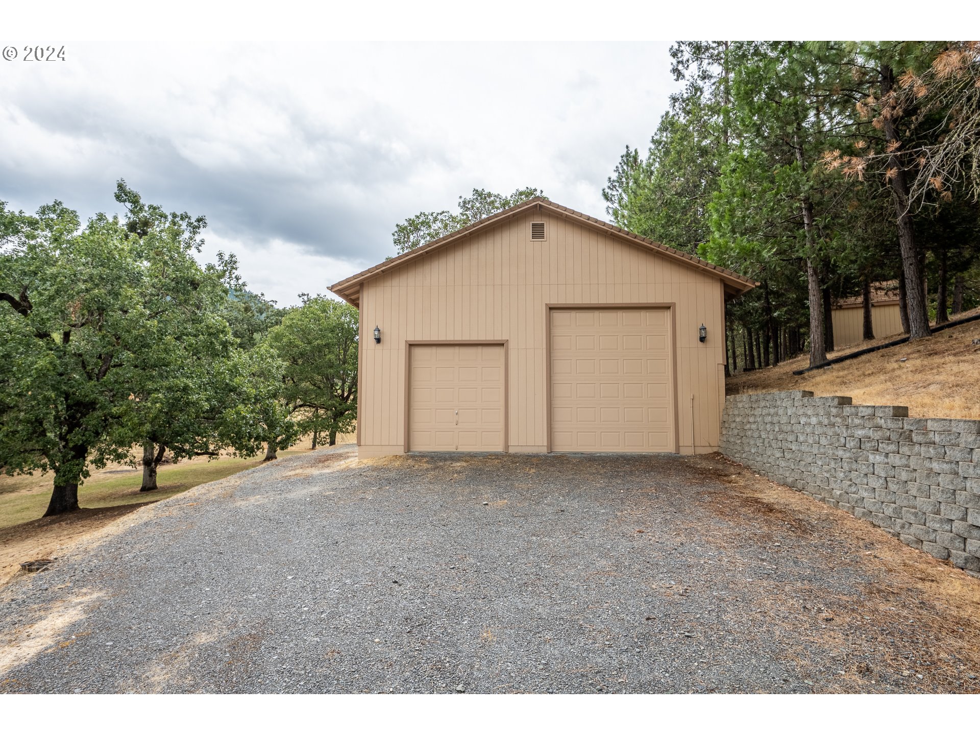 6600 Tunnel Loop Road Grants Pass, OR 97526 - Photo 8 of 43 a view of a house with a backyard