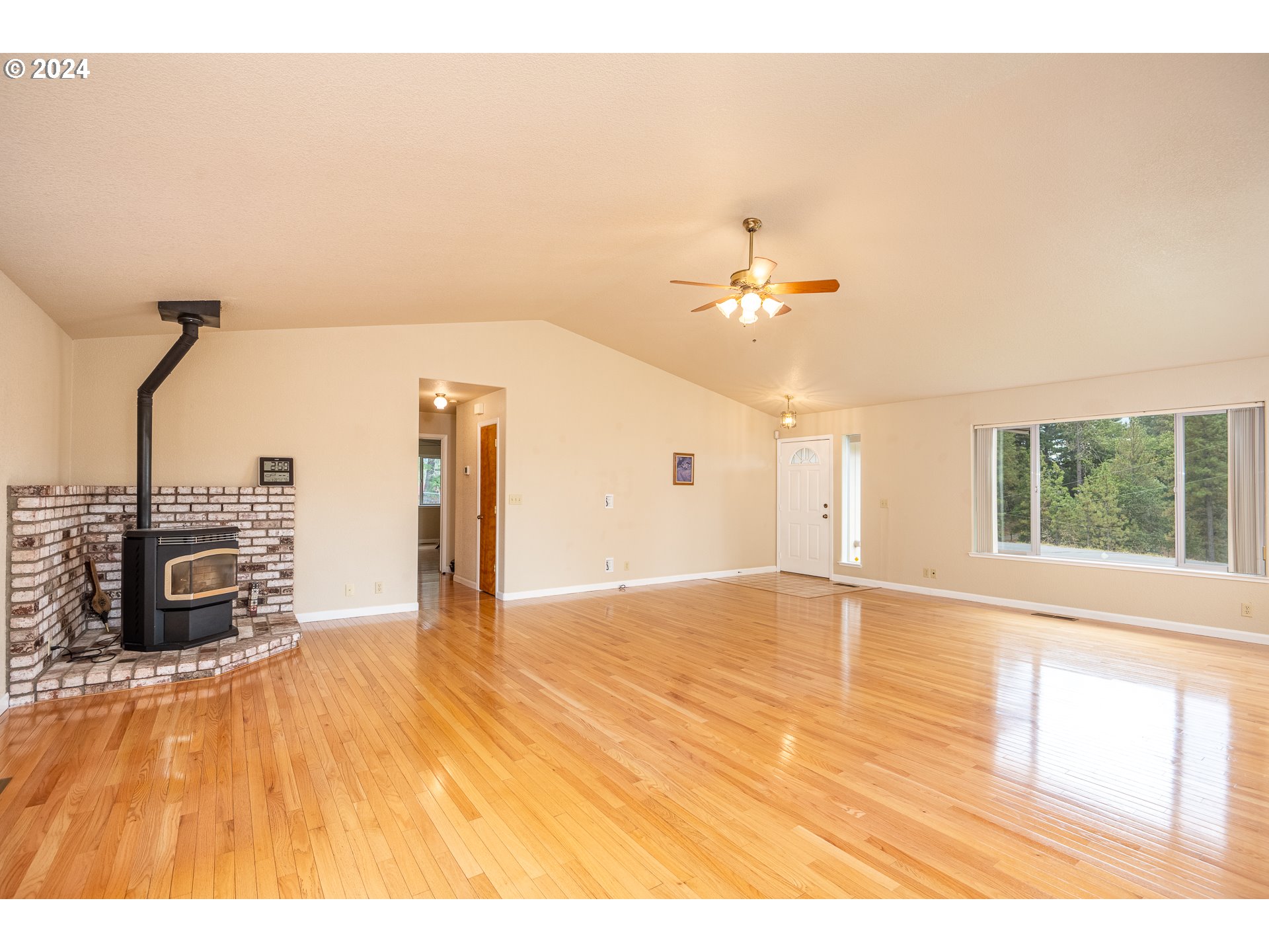 6600 Tunnel Loop Road Grants Pass, OR 97526 - Photo 10 of 43 a view of a room with a window and hardwood floor