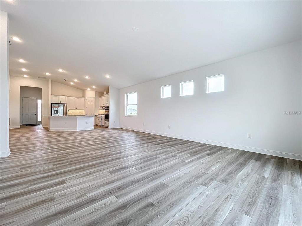 3951 Kennebunk Loop Mount Dora, FL 32757 - Photo 20 of 54 a view of a living room with a wooden floor