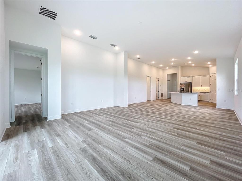 3951 Kennebunk Loop Mount Dora, FL 32757 - Photo 21 of 54 a view of kitchen and utility room