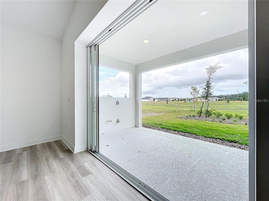 3951 Kennebunk Loop Mount Dora, FL 32757 - Photo 22 of 54 a view of a room with a big yard
