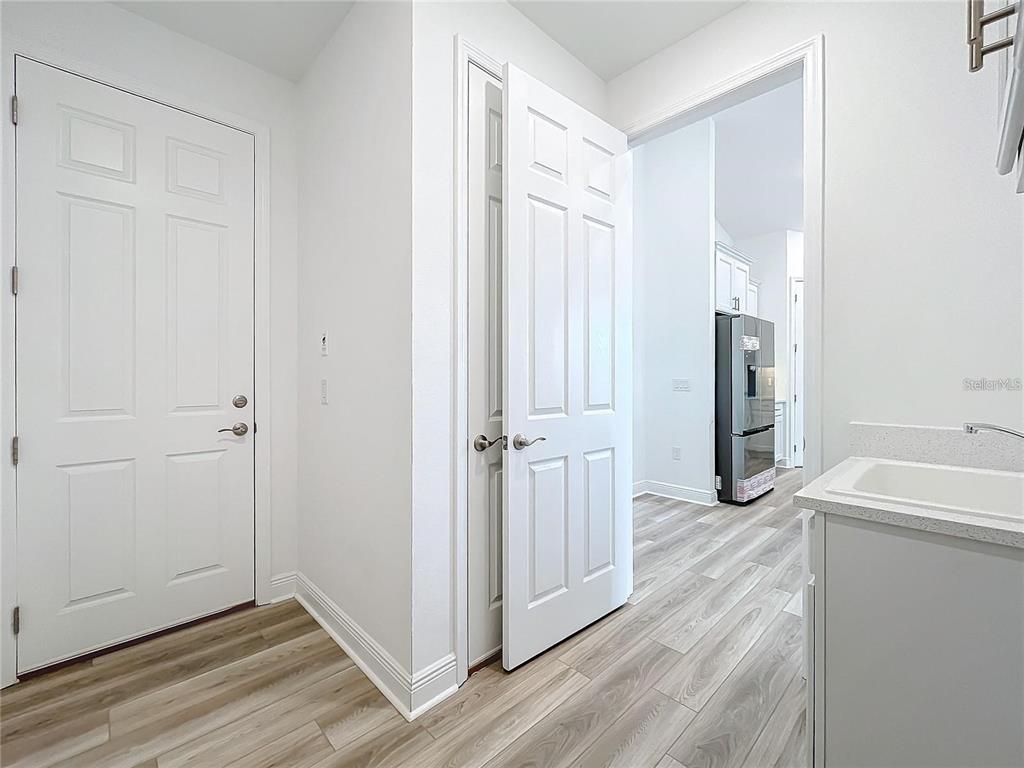 3951 Kennebunk Loop Mount Dora, FL 32757 - Photo 43 of 54 a view of a kitchen from a hallway