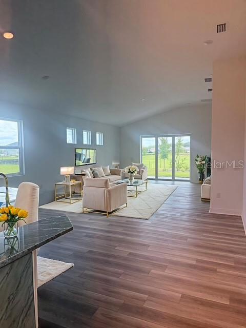 3951 Kennebunk Loop Mount Dora, FL 32757 - Photo 54 of 54 a living room with furniture and a wooden floor